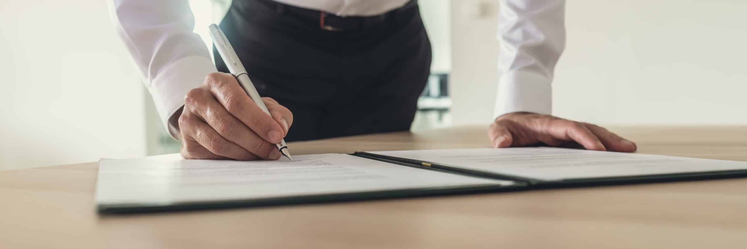 businessman signing