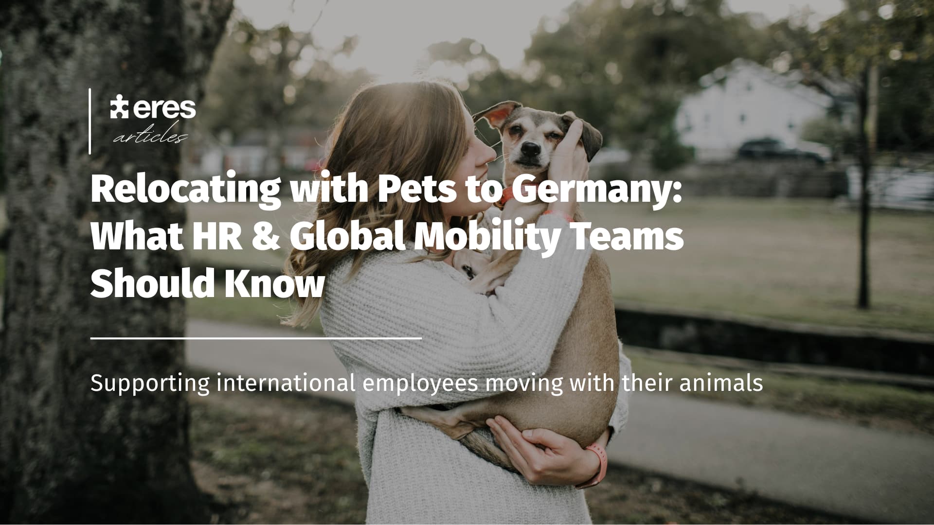 Young woman holding her dog - International relocation with pets