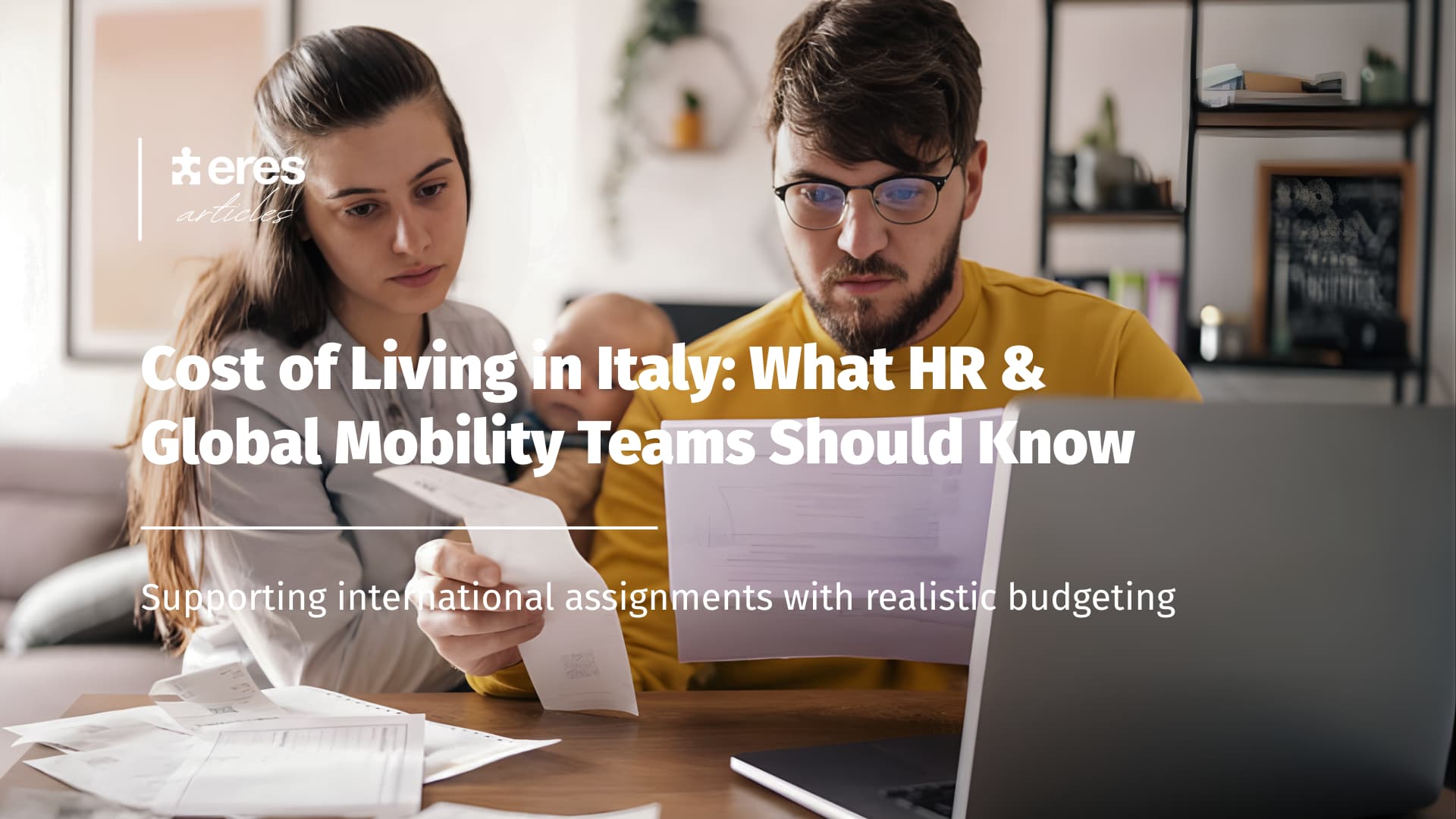 A couple looking at administrative documents and a laptop - Realistic international assignments budgeting
